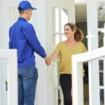 home services tech at door with home owner