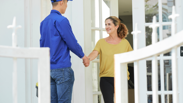 home services tech at door with home owner