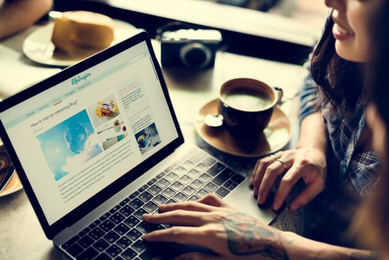 woman viewing website on laptop computer
